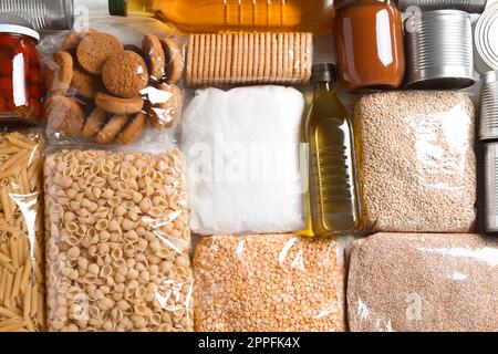 Many products on table, flat lay. Food donation Stock Photo