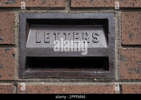 Wall detail with painted text, letters, words in Hebrew. At an old ...