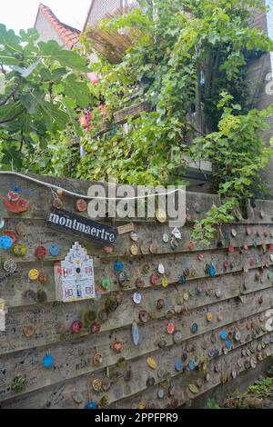 Zierikzee, The Netherlands August 27th 2020 - Plein Montmaertre - Wooden discs with wishes on a  fence Stock Photo