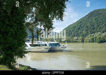 Cruise ships on the Danube at a mooring near Duernstein in Austria Stock Photo