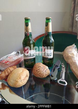 2 bottles of Pilsner Urquell beer on a table to have a dinner in Prague, Czech Stock Photo