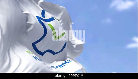 The flag of Hauts de France region waving in the wind on a clear day Stock Photo