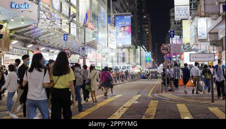 Mong Kok, Hong Kong 10 December 2020: People walk in the street at night Stock Photo