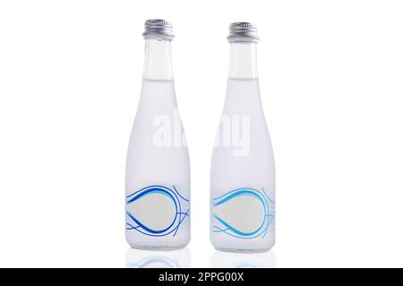 Two bottles of mineral water isolated on white Stock Photo