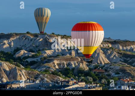 hot air balloons fly over the city of goreme Stock Photo