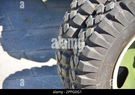 A close-up wheels of a portable weapon of the Soviet Union of World War II, painted in a dark green Stock Photo