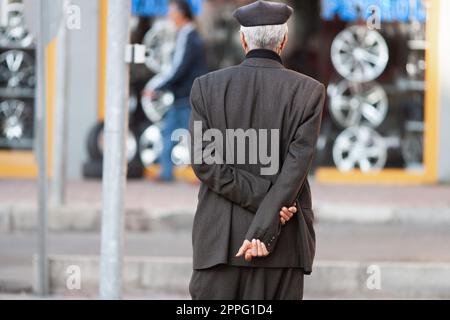 a stylish elderly man dressed in a traditional Turkish costume. Stock Photo