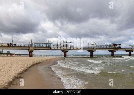 Miedzyzdroje pier, long wooden jetty entering the Baltic Sea from the beach, Wolin Island, Miedzyzdroje, Poland Stock Photo