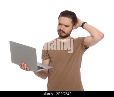 Pensive man using laptop on white background Stock Photo