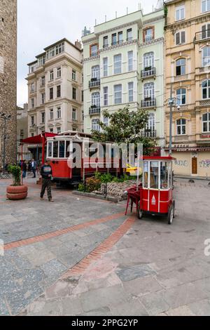 Historic trams at Galata tower square in Taksim area, Istanbul, Turkey Stock Photo