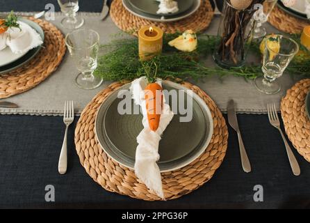 easter table decorations ready for a family meal at home. Stock Photo