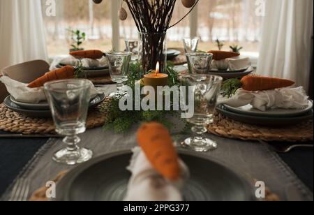 easter table decorations ready for a family dinner Stock Photo