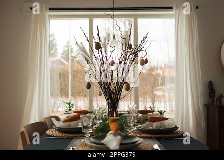 easter dinner table decorated ready for a celebration meal Stock Photo