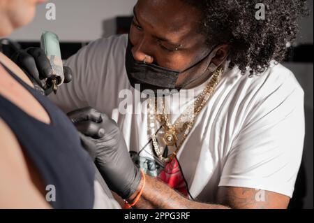 Body art at the tattoo studio Stock Photo