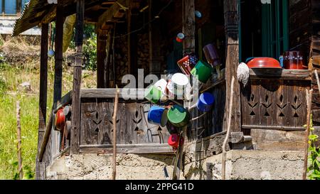 Pots and kitchen utensils at an old farm house in malamutes Stock Photo