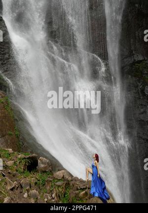 KEDA,GEORGIA -03 MAY, 2023: girl enjoying under Makhuntseti waterfall Stock Photo