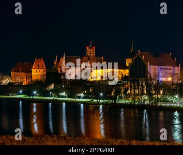 Castle of the Teutonic Order by night in Malbork, Pomerania, Poland Stock Photo