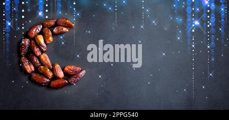 Ramadan Kareem with dates fruits arranged in shape of crescent moon on ...
