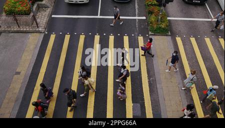 Tsuen Wan, Hong Kong 03 May 2021:  Top down view of people cross the street Stock Photo