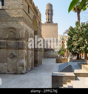 Entrance of public historic Al Hakim Mosque - Enlightened Mosque - and Minaret, Moez Street, Cairo Stock Photo