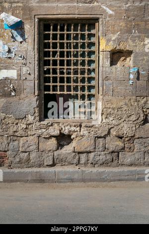 Old brick wall and wooden broken window. A broken window in an old ...