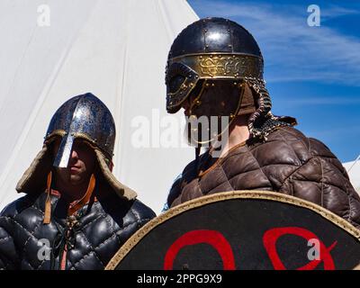 Medieval spectacle. equipped performers who pursue as warriors their leisure hobby. Stock Photo