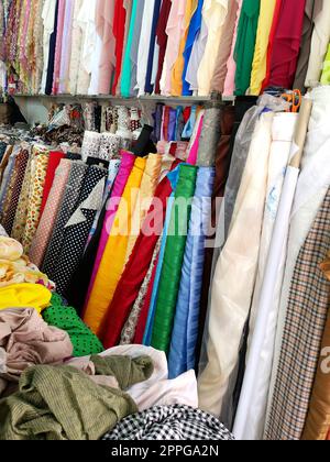 Many color fabric rolls in the fabric shop Stock Photo