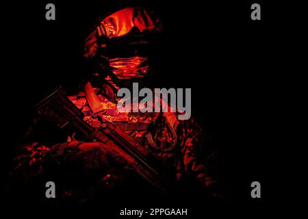 Special forces soldier in the red light Stock Photo