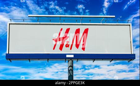 Advertisement billboard displaying logo of Hennes & Mauritz Stock Photo