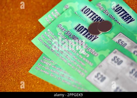 Close up view of green lottery scratch cards. Many used fake instant lottery tickets with gambling results. Gambling addiction Stock Photo