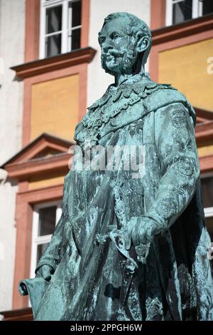 The monument to King Maximilian II of Bavaria stands in front of the Old Palace in Bayreuth on the courtyard. The statue of the Maximilian monument was cast in 1860 and stands on a granite base. Stock Photo