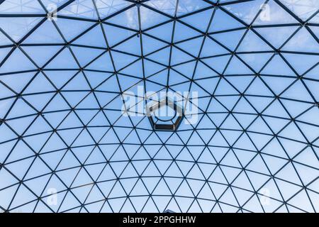 Structural glass facade curving roof of modern architectural building Stock Photo