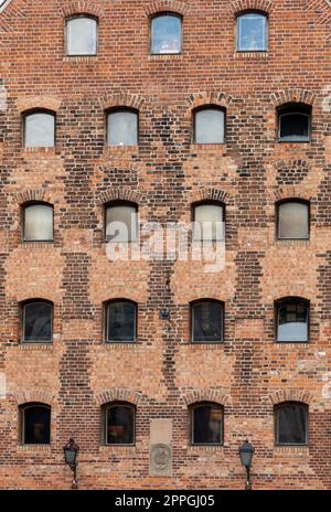 Facade of restored medieval granary on the Granary island in the old town of Gdansk Stock Photo