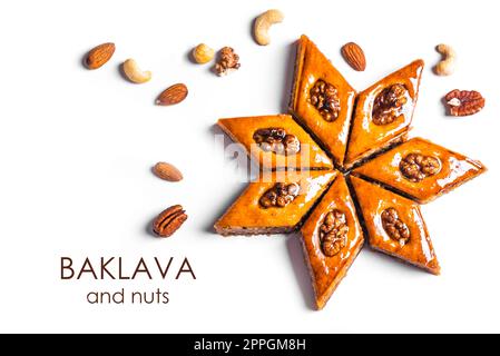 Arabic Baklava with walnuts and honey isolated on white background. Ramadan dessert - fresh nut baklava. Stock Photo