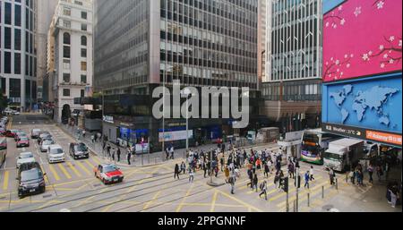 Central, Hong Kong 27 January 2021: People cross the road in city Stock Photo