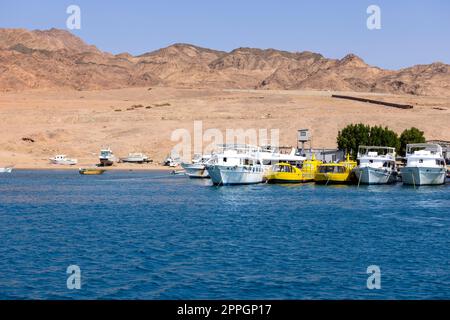 View of dive boats moored in the port, Dahab, Egypt Stock Photo