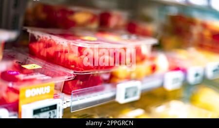 Packages with fruits displayed in a commercial refrigerator Stock Photo