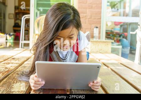 Children playing tablet Stock Photo