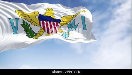 Flags of United States Virgin Islands waving in the wind with the US flag on a clear day Stock Photo