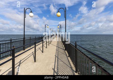 Miedzyzdroje pier, long wooden jetty entering the Baltic Sea from the beach, Island Wolin, Miedzyzdroje, Poland Stock Photo