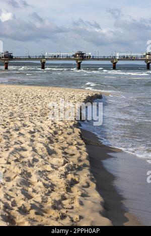 Miedzyzdroje pier, long wooden jetty entering the Baltic Sea from the beach, West Pomerania Province, Miedzyzdroje, Poland Stock Photo