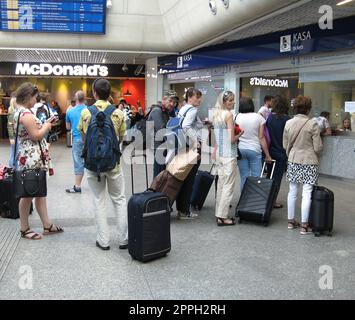 Line of people at the box office for tickets. People standing in the queue Stock Photo