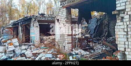 Destruction of buildings after being hit by artillery shell. Russian invasion Stock Photo