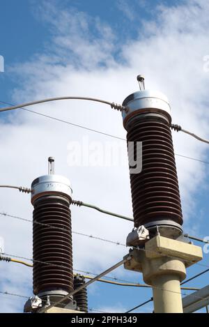 Ceramic insulators on a high voltage power line. Detail close up. Stock Photo