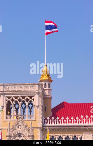 Flag of Thailand waving atop the Government House of Thailand, in Bangkok. Stock Photo