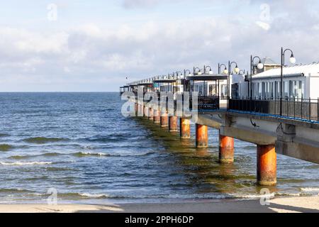 Miedzyzdroje pier, long wooden jetty entering the Baltic Sea from the beach, West Pomerania Province, Miedzyzdroje, Poland Stock Photo