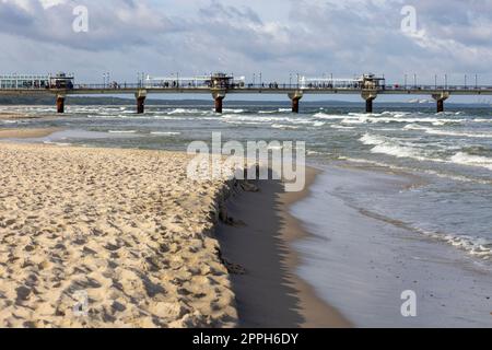 Miedzyzdroje pier, long wooden jetty entering the Baltic Sea from the beach, West Pomerania Province, Miedzyzdroje, Poland Stock Photo