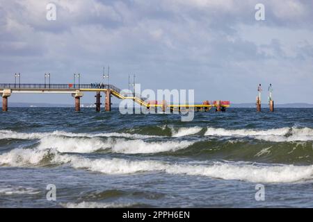 Miedzyzdroje pier, long wooden jetty entering the Baltic Sea from the beach, West Pomerania Province, Miedzyzdroje, Poland Stock Photo