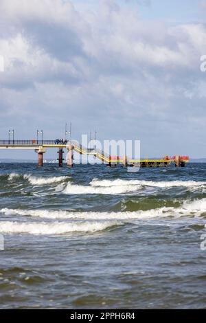 Miedzyzdroje pier, long wooden jetty entering the Baltic Sea from the beach, West Pomerania Province, Miedzyzdroje, Poland Stock Photo