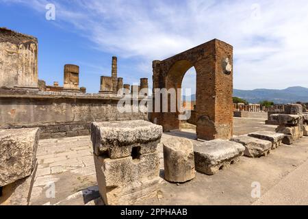 Forum of city destroyed by the eruption of the volcano Vesuvius, view of the Temple of Jupiter, Pompeii, Italy Stock Photo